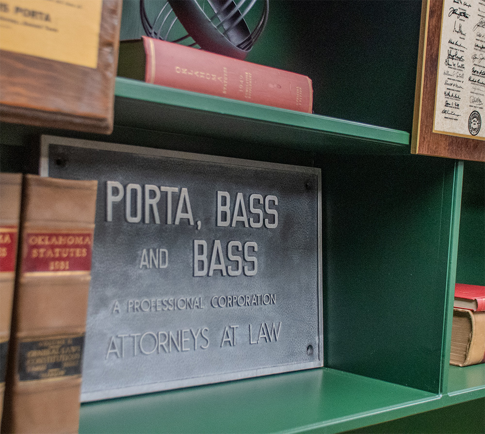 Porta, Bass, and Bass metal sign on a shelf in the green room.